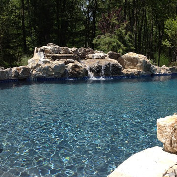 Custom Pools & Spas, Outdoor Kitchens, Patios & Walkways, and Plantings
