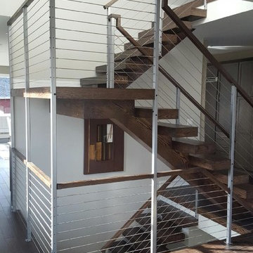 Open riser stairs with stainless steel cable wire railing