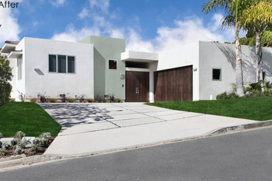 Example of a large minimalist white one-story exterior home design in Orange County