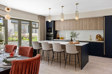 Kitchen - large contemporary light wood floor and beige floor kitchen idea in Dublin