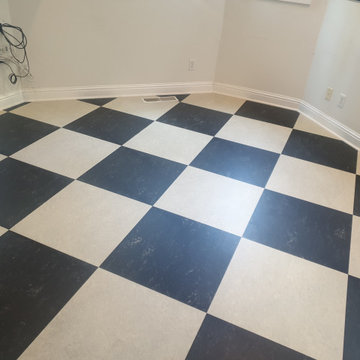 Diagonal Concrete & Black Marmoleum in Fremont Home Remodel