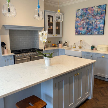 Stunning light blue kitchen with white quartz worktops, kitchen island and glaze