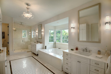 Inspiration for a large timeless master white tile and stone tile marble floor and white floor alcove shower remodel in Miami with an undermount sink, white cabinets, marble countertops, an undermount tub, white walls, raised-panel cabinets and white countertops