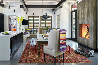 Inspiration for a modern open concept concrete floor and gray floor living room remodel in Denver with white walls, a standard fireplace, a concrete fireplace and a wall-mounted tv