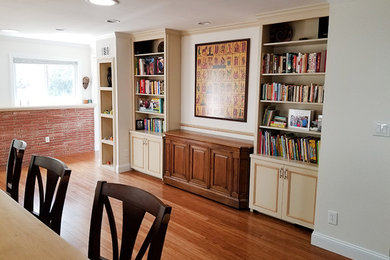 Family room - mid-sized transitional open concept brown floor family room idea in DC Metro with white walls, no fireplace and no tv