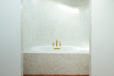Inspiration for a small mediterranean white tile and terra-cotta tile terra-cotta tile, brown floor, single-sink and vaulted ceiling bathroom remodel in Portland with open cabinets, medium tone wood cabinets, a bidet, white walls, a drop-in sink, marble countertops, green countertops, a niche and a built-in vanity
