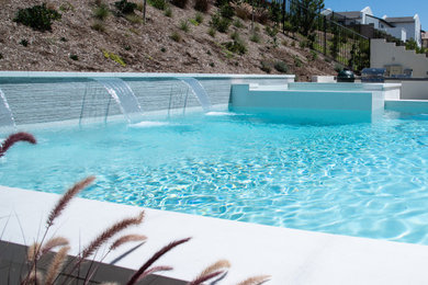 Small minimalist backyard custom-shaped aboveground pool landscaping photo in San Diego with decking