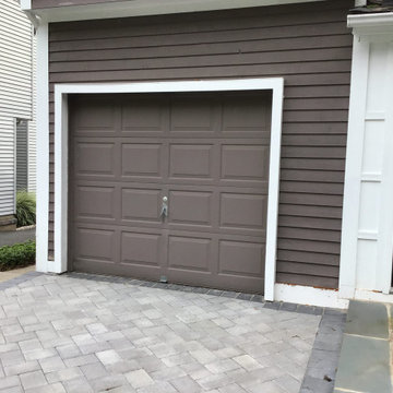 Recessed Panel Garage Door in Black (before)