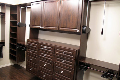 Bedroom - dark wood floor bedroom idea in Calgary with white walls
