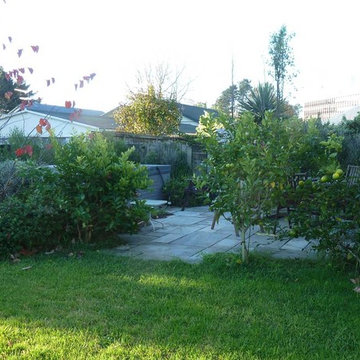 The patio corner has citrus trees for luxurious night scent and lemons for the g
