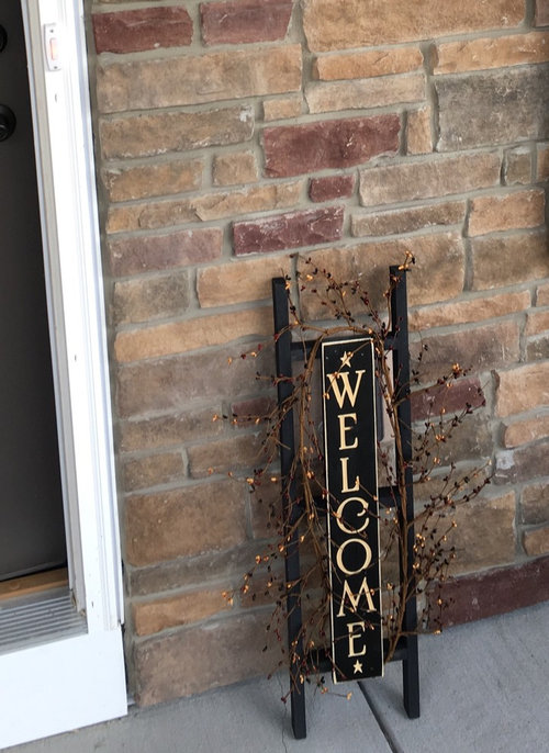 How to hang a decorative sign on brick house without drilling.