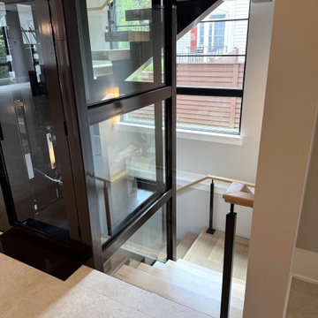 Project #136 | Modern Floating Staircase Encircling Glass Elevator