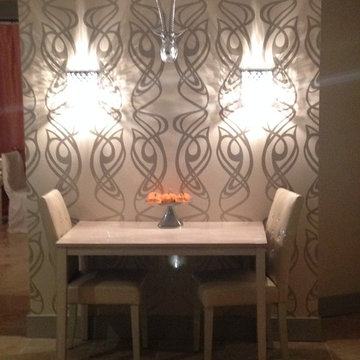 After - paneled shelving becomes accent wall with wallpaper and sconces