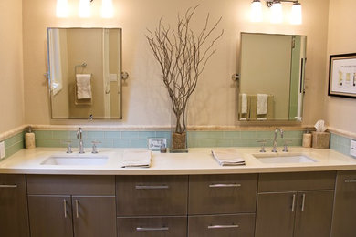 Corner shower - small transitional master green tile and glass tile marble floor corner shower idea in San Diego with an undermount sink, flat-panel cabinets, gray cabinets, quartz countertops, a two-piece toilet and beige walls