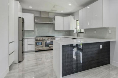 Mid-sized minimalist l-shaped porcelain tile open concept kitchen photo in Miami with flat-panel cabinets and an island