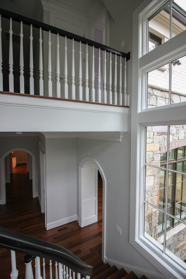 Powerful Impression by Floating Staircase in Suburban Foyer