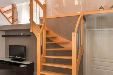 Design ideas for a small country wood l-shaped staircase in Other with open risers and mixed railing.