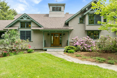 Example of a huge arts and crafts gray three-story wood exterior home design in Other with a shingle roof