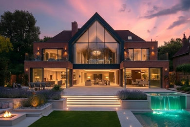 Inspiration for an expansive modern house exterior in Surrey.