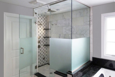 Inspiration for a large modern master bathroom in Chicago with a drop-in tub, a corner shower, gray tile, marble, grey walls and a hinged shower door.