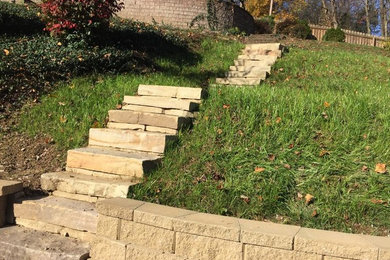 Design ideas for a mid-sized full sun front yard stone garden path in Other.
