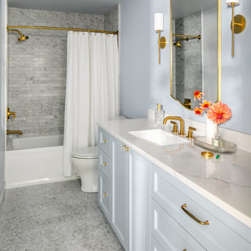 Around the Corner Condo bathroom with marble and brass