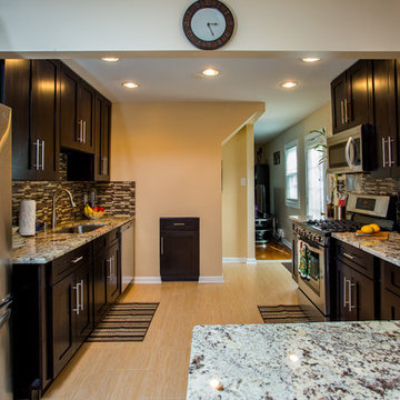 Contemporary Espresso Kitchen Remodel with Granite Counters & Mosaic Backsplash