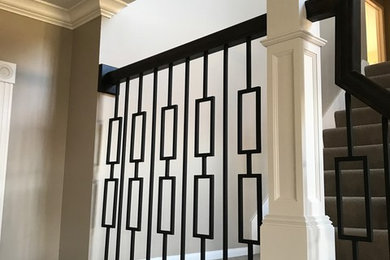 Elegant staircase photo in Cedar Rapids