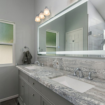 Gray Double Vanity with Granite Top and Illuminated Mirror