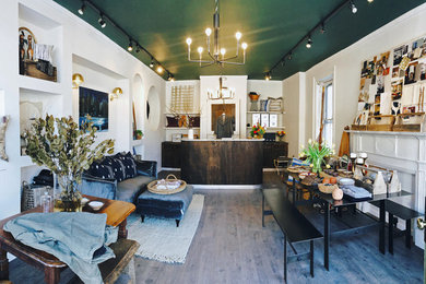 Example of a mid-sized trendy built-in desk vinyl floor and gray floor home studio design in New York with white walls, a standard fireplace and a wood fireplace surround