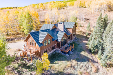 Mountain style home design photo in Denver