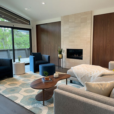 Living room - mid-sized 1950s open concept dark wood floor, brown floor and exposed beam living room idea in San Francisco with white walls, a standard fireplace, a stone fireplace and no tv
