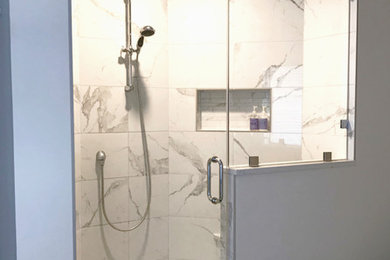Example of a small trendy master white tile and porcelain tile porcelain tile and white floor bathroom design in Calgary with shaker cabinets, a one-piece toilet, gray walls, an undermount sink, quartz countertops, a hinged shower door and white countertops