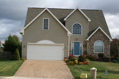 Mid-sized beige two-story wood exterior home photo in Other