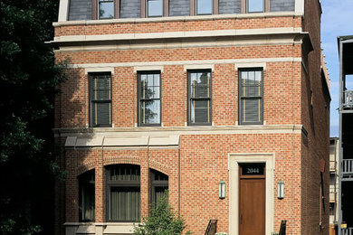 Foto de fachada de casa beige clásica renovada grande de tres plantas con revestimiento de ladrillo, tejado a dos aguas y tejado de teja de barro