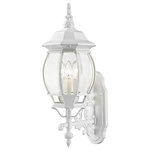 Livex Lighting - Textured White Traditional, Colonial, French Historical, Outdoor Wall Lantern - The classically transitional outdoor Frontenac collection boasts a cast aluminum structure with dazzling ornamental design.  The upward facing three-light medium six-sided wall lantern comes in a textured white finish with clear beveled glass and extravagantly decorative scrolls. The ornate quality of this light will add radiance to your house exterior day or night.