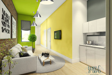 Mid-sized minimalist open concept light wood floor living room photo in New York with yellow walls, no fireplace and a wall-mounted tv