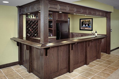 Home bar - mid-sized traditional home bar idea in Other