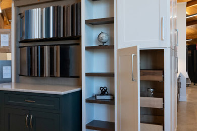 Inspiration for a large contemporary single-wall wood ceiling kitchen pantry remodel in Other with flat-panel cabinets, white cabinets, quartzite countertops, an island and white countertops