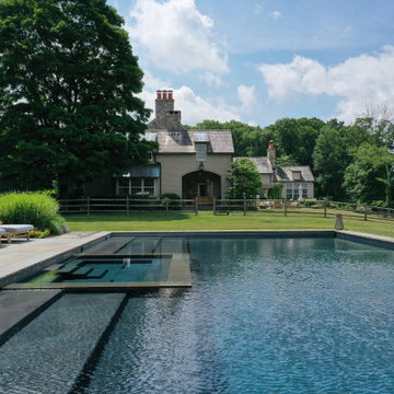 large rectangular pool with oversized steps + interior spa