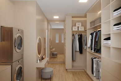 Example of a large minimalist gender-neutral walk-in closet design in Dallas