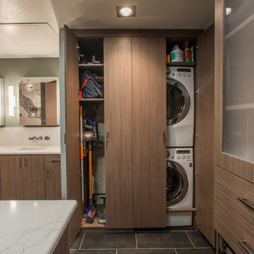 Modern Wood Tone Walk-in Closet with Frosted Glass Inserts