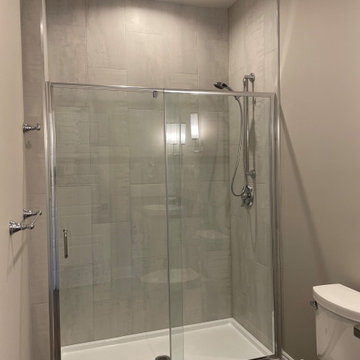 Beautiful Shower done with 12x24 porcelain tiles installed vertically.
