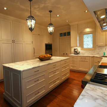 Wall of Pantry Cabinets and Island Storage Maximize Space in Woodmode Kitchen