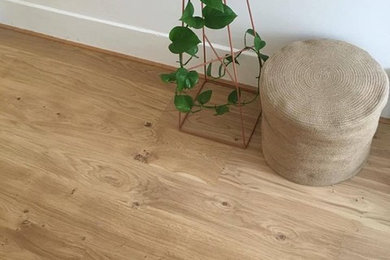 A Simple Planter and Ottoman Against Engineered Wood Planks