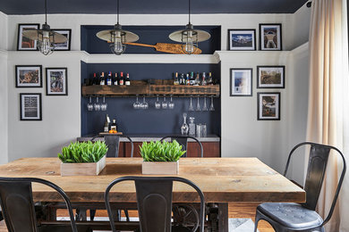 Inspiration for a beach style dining room in Toronto with medium hardwood floors and multi-coloured walls.