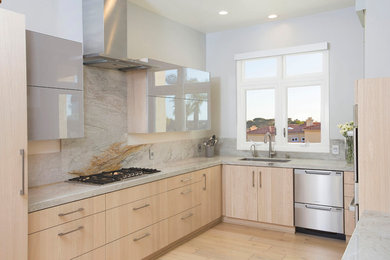 Eat-in kitchen - mid-sized modern u-shaped light wood floor eat-in kitchen idea in San Diego with an undermount sink, flat-panel cabinets, light wood cabinets, granite countertops, gray backsplash, stone slab backsplash, stainless steel appliances and no island