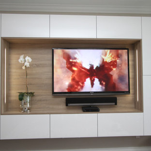 Inspiration for a large modern enclosed home cinema in Miami with white walls and a built-in media unit.