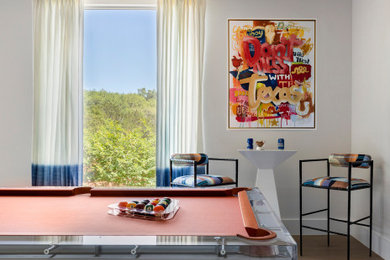 Large trendy enclosed light wood floor and beige floor game room photo in Austin with white walls, no fireplace and no tv