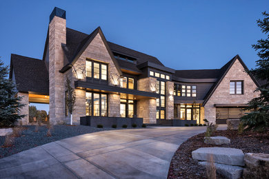 Inspiration for a huge transitional gray three-story mixed siding exterior home remodel in Other with a mixed material roof